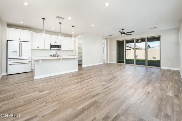 a view of kitchen with wooden floor and window