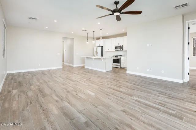 a view of kitchen with cabinets and wooden floor
