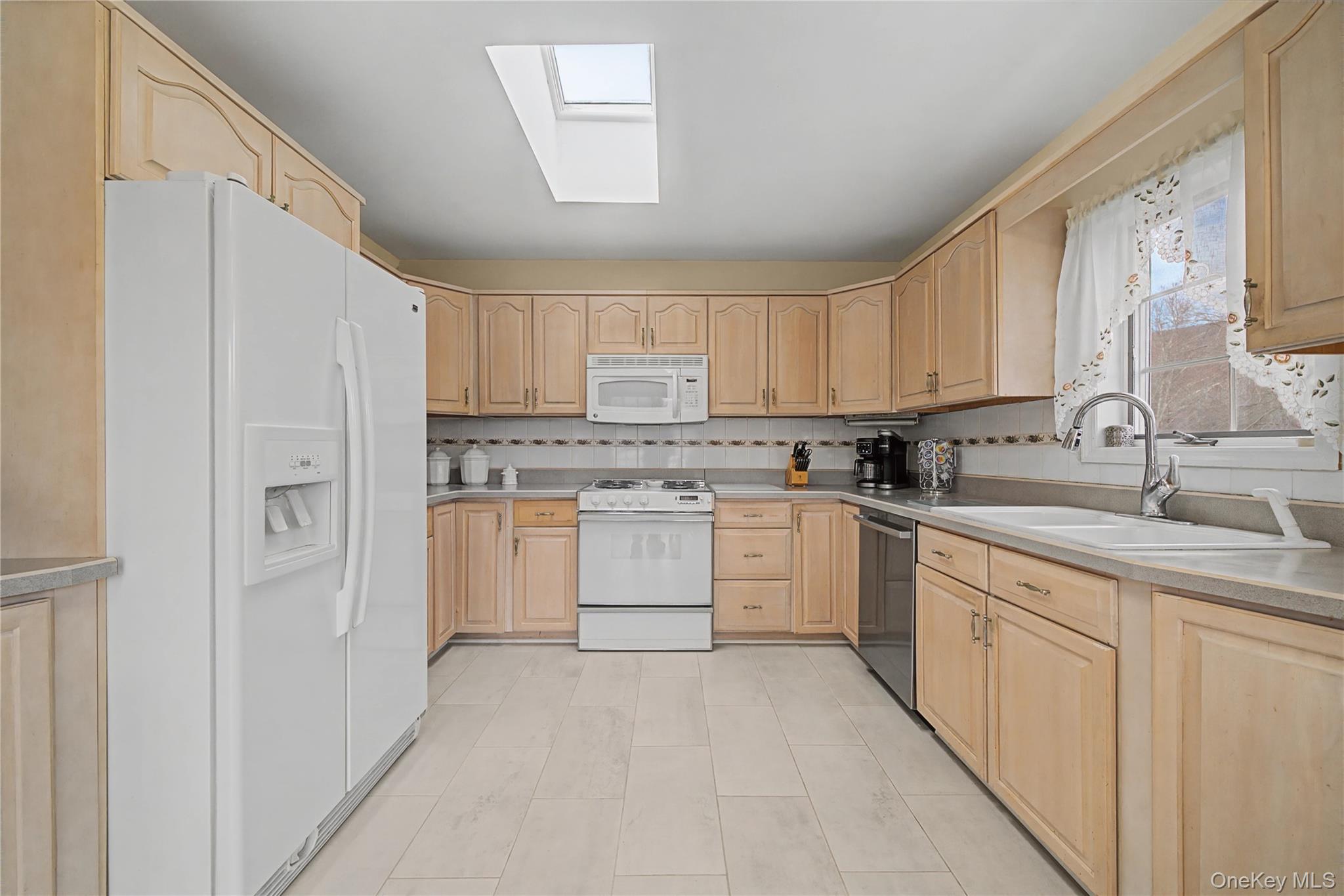 6 Adams Court Monroe, NY 10950 - Photo 14 of 44 a kitchen with white cabinets white stainless steel appliances and sink