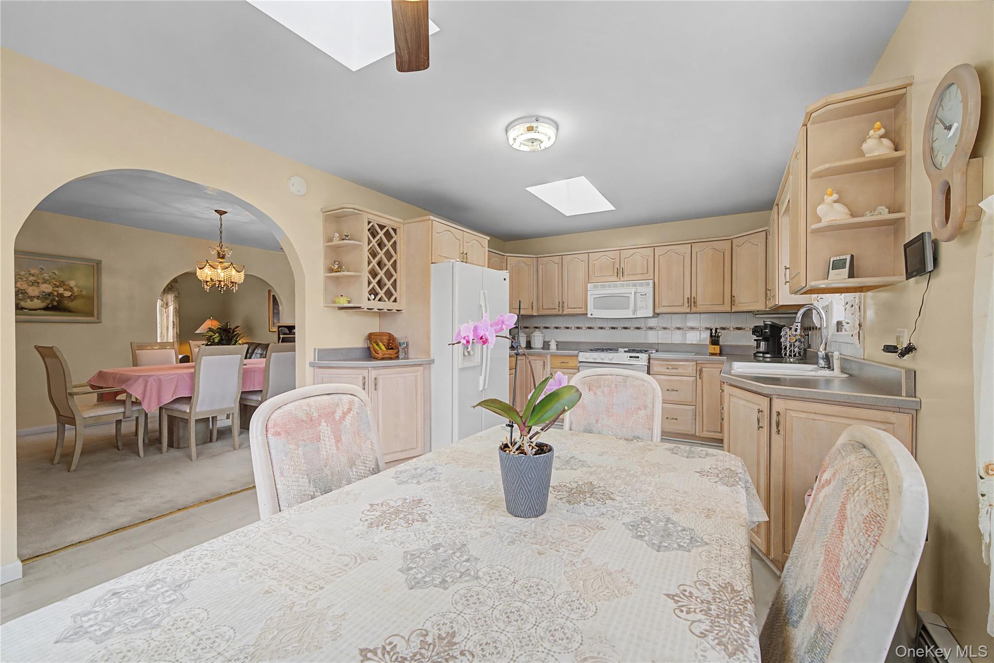 6 Adams Court Monroe, NY 10950 - Photo 15 of 44 a kitchen with a white cabinets and chair
