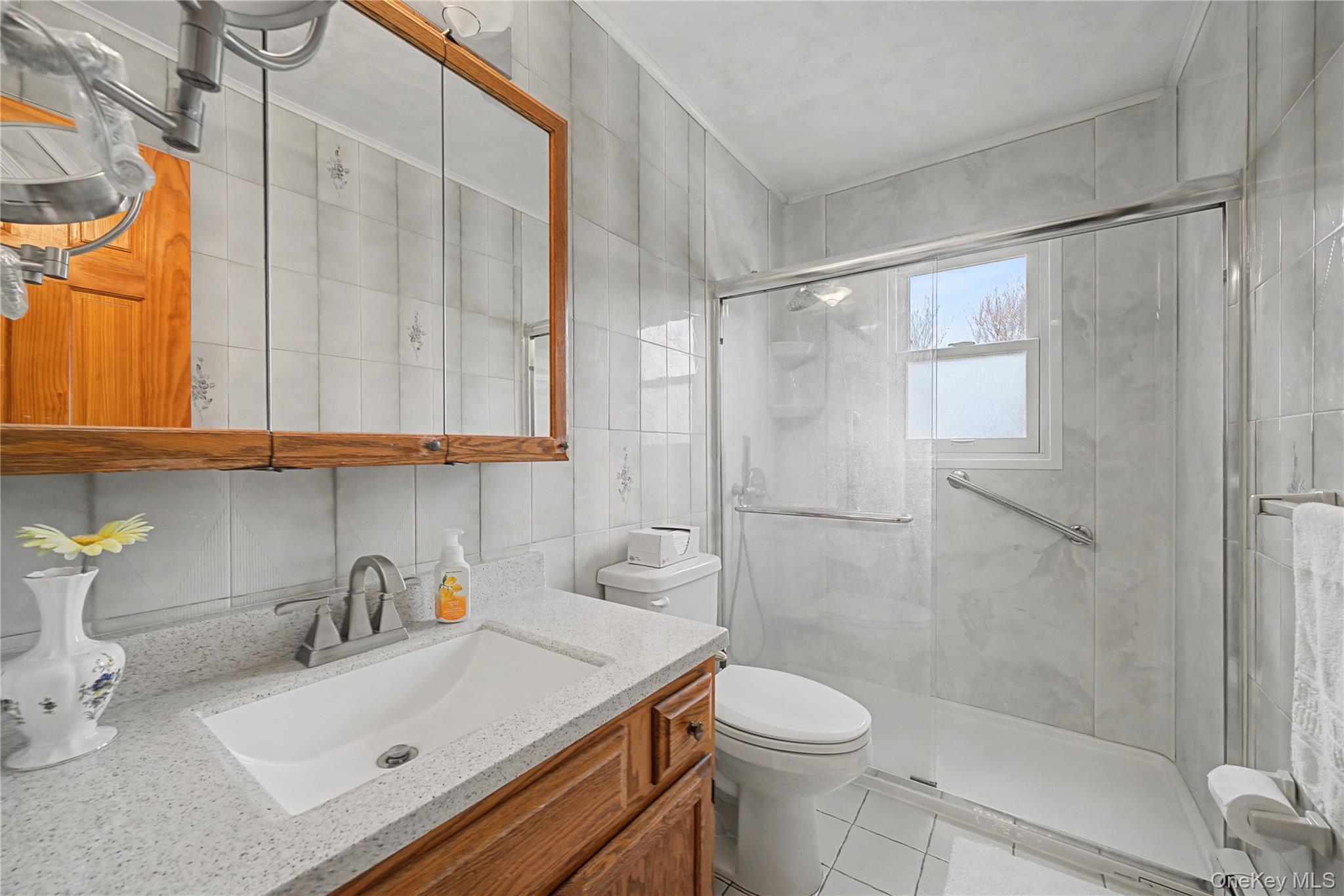 6 Adams Court Monroe, NY 10950 - Photo 19 of 44 a bathroom with a sink toilet and shower