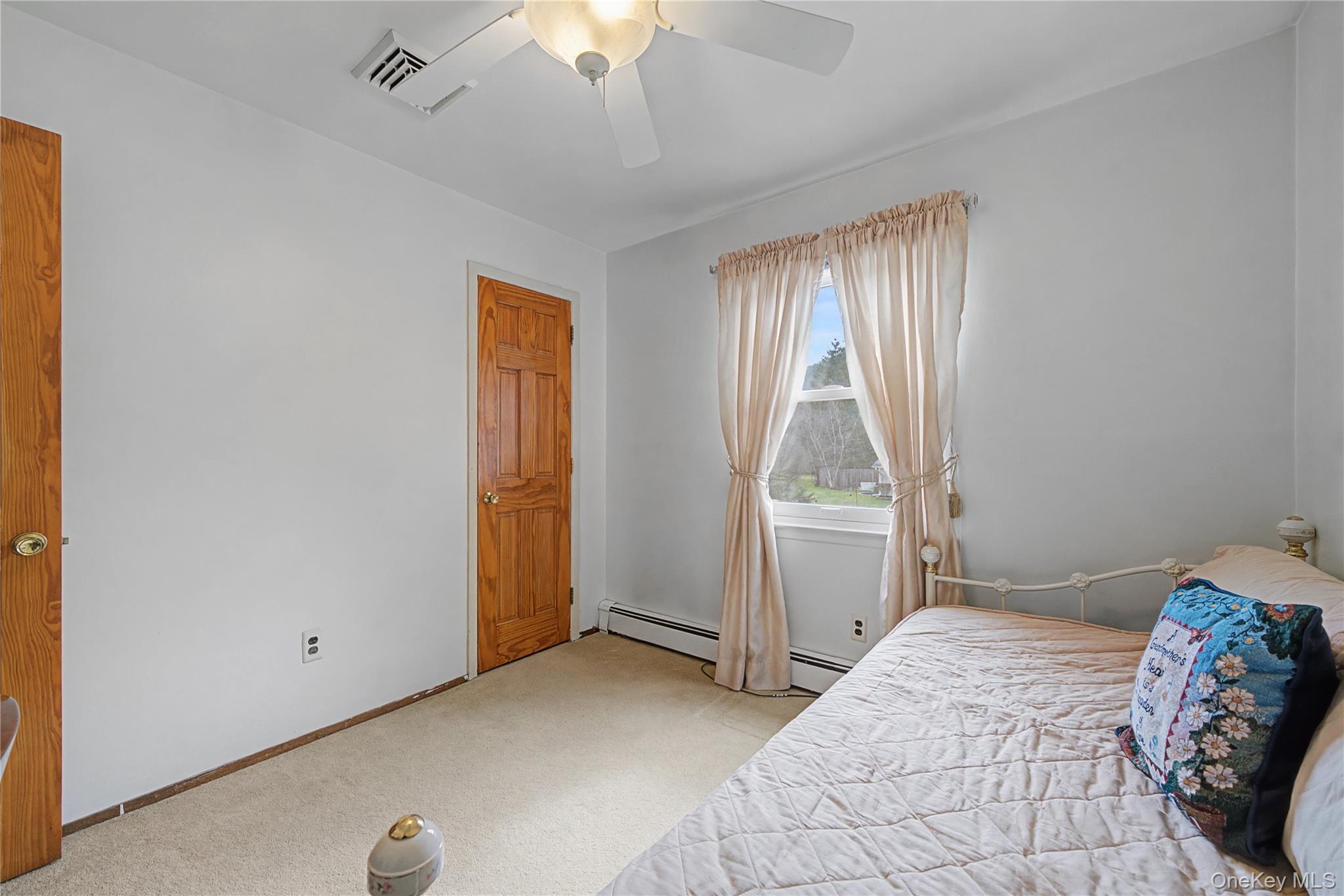6 Adams Court Monroe, NY 10950 - Photo 21 of 44 a bedroom with a bed and a window