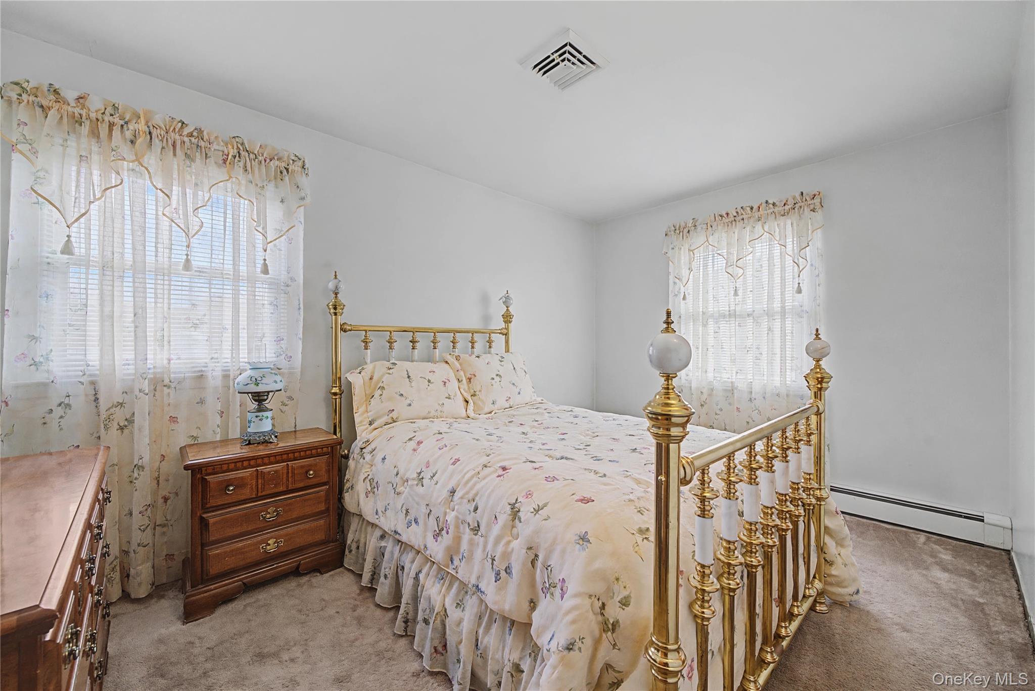 6 Adams Court Monroe, NY 10950 - Photo 22 of 44 a bedroom with a bed and a baby crib