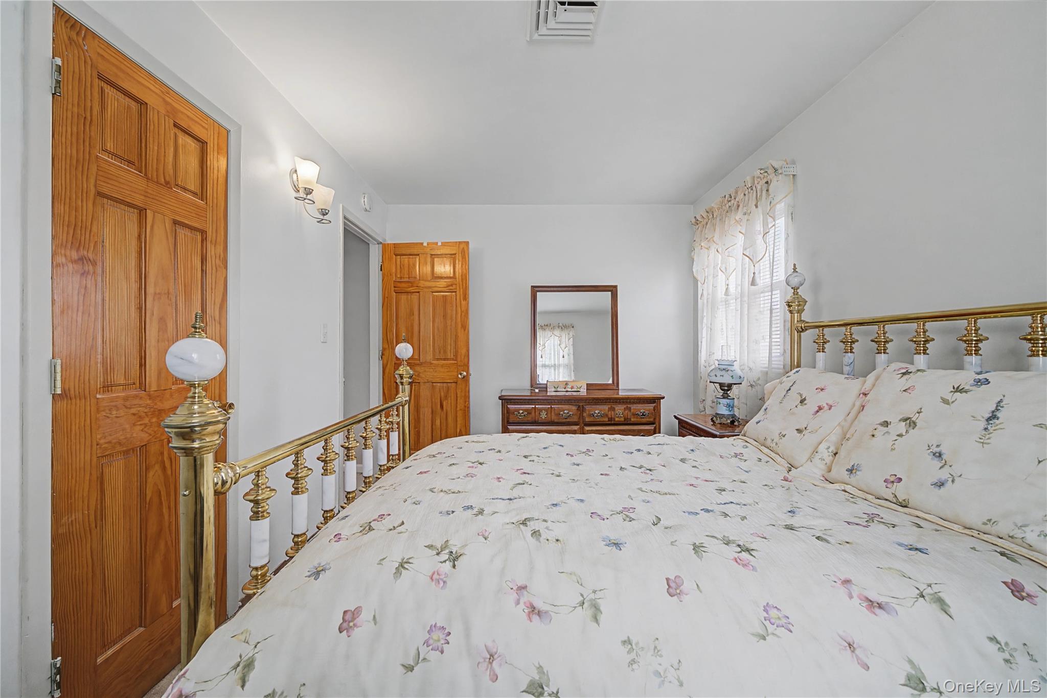 6 Adams Court Monroe, NY 10950 - Photo 23 of 44 a bedroom with a large bed and a dresser