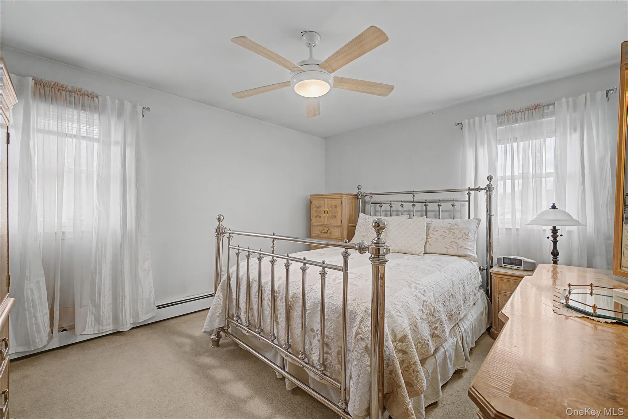 6 Adams Court Monroe, NY 10950 - Photo 24 of 44 a bedroom with a bed and a chandelier