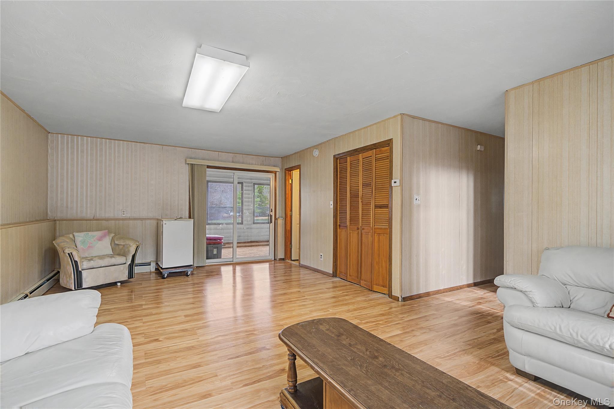 6 Adams Court Monroe, NY 10950 - Photo 28 of 44 a living room with furniture and wooden floor
