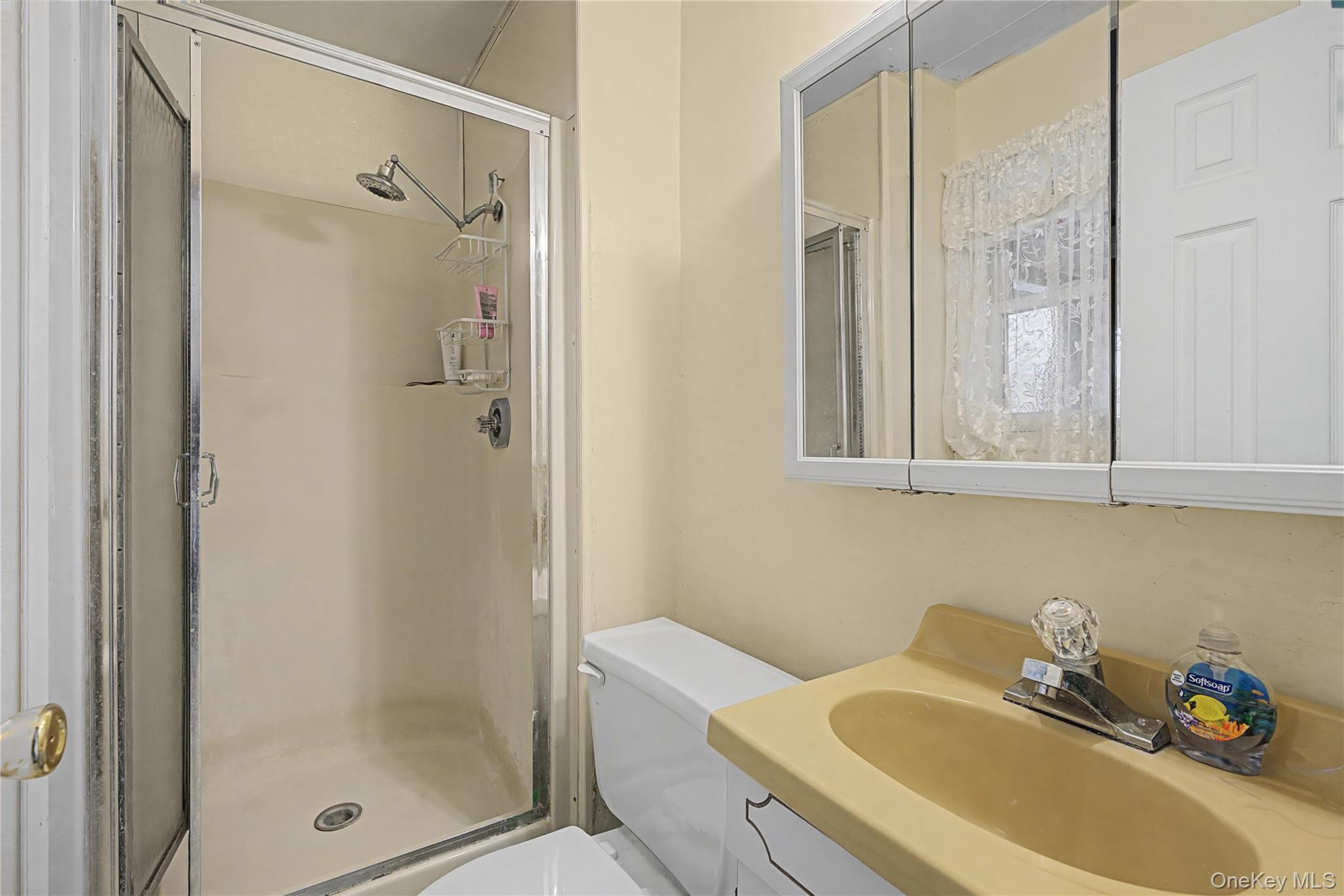 6 Adams Court Monroe, NY 10950 - Photo 30 of 44 a bathroom with a tub shower sink and mirror