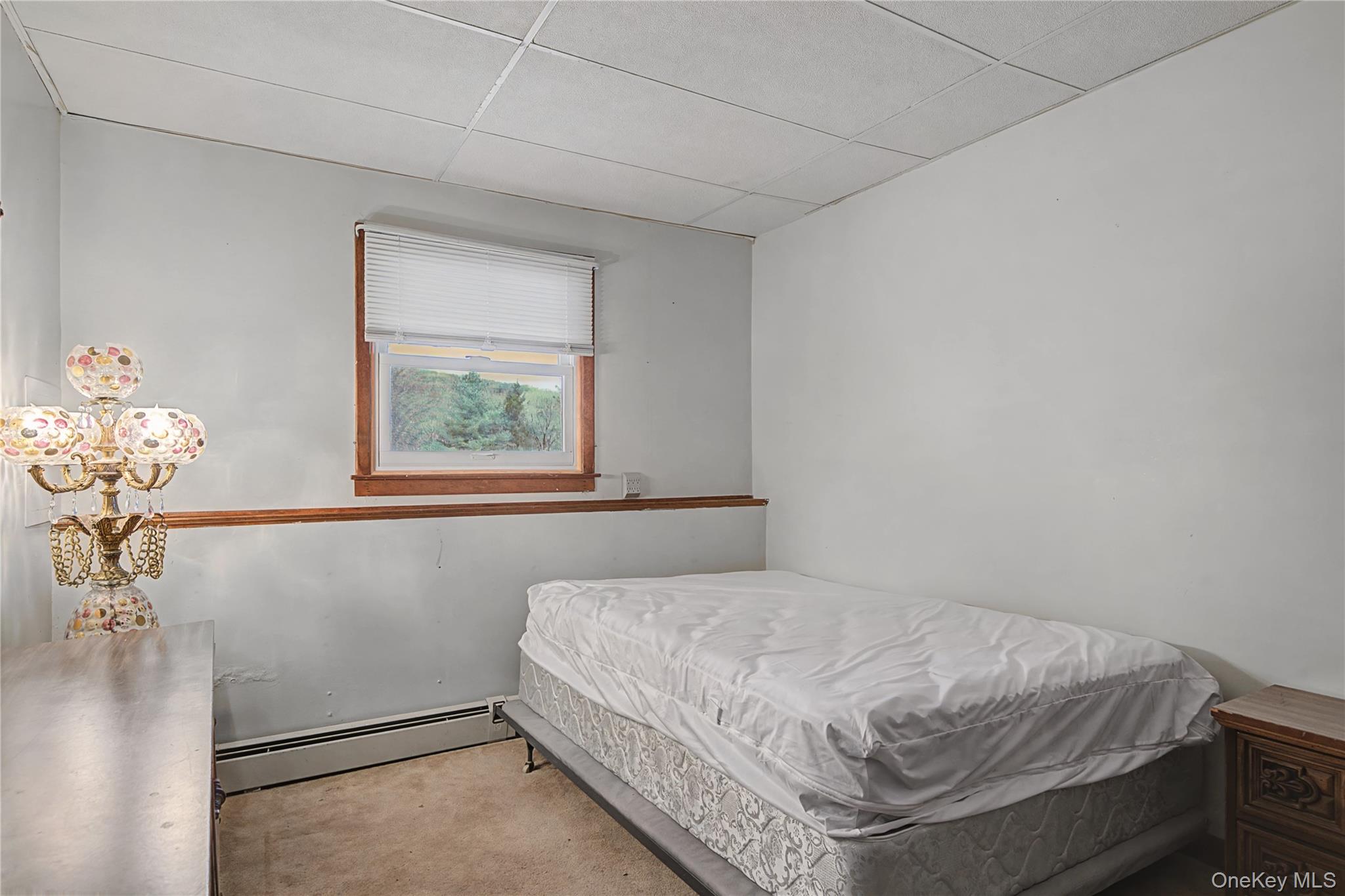 6 Adams Court Monroe, NY 10950 - Photo 31 of 44 a bedroom with a bed and a window
