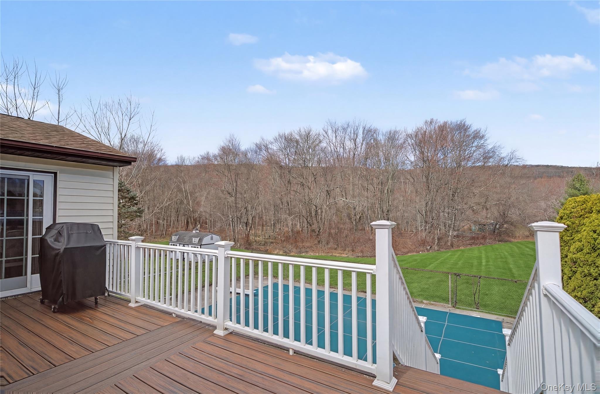 6 Adams Court Monroe, NY 10950 - Photo 36 of 44 a view of a wooden deck with a yard