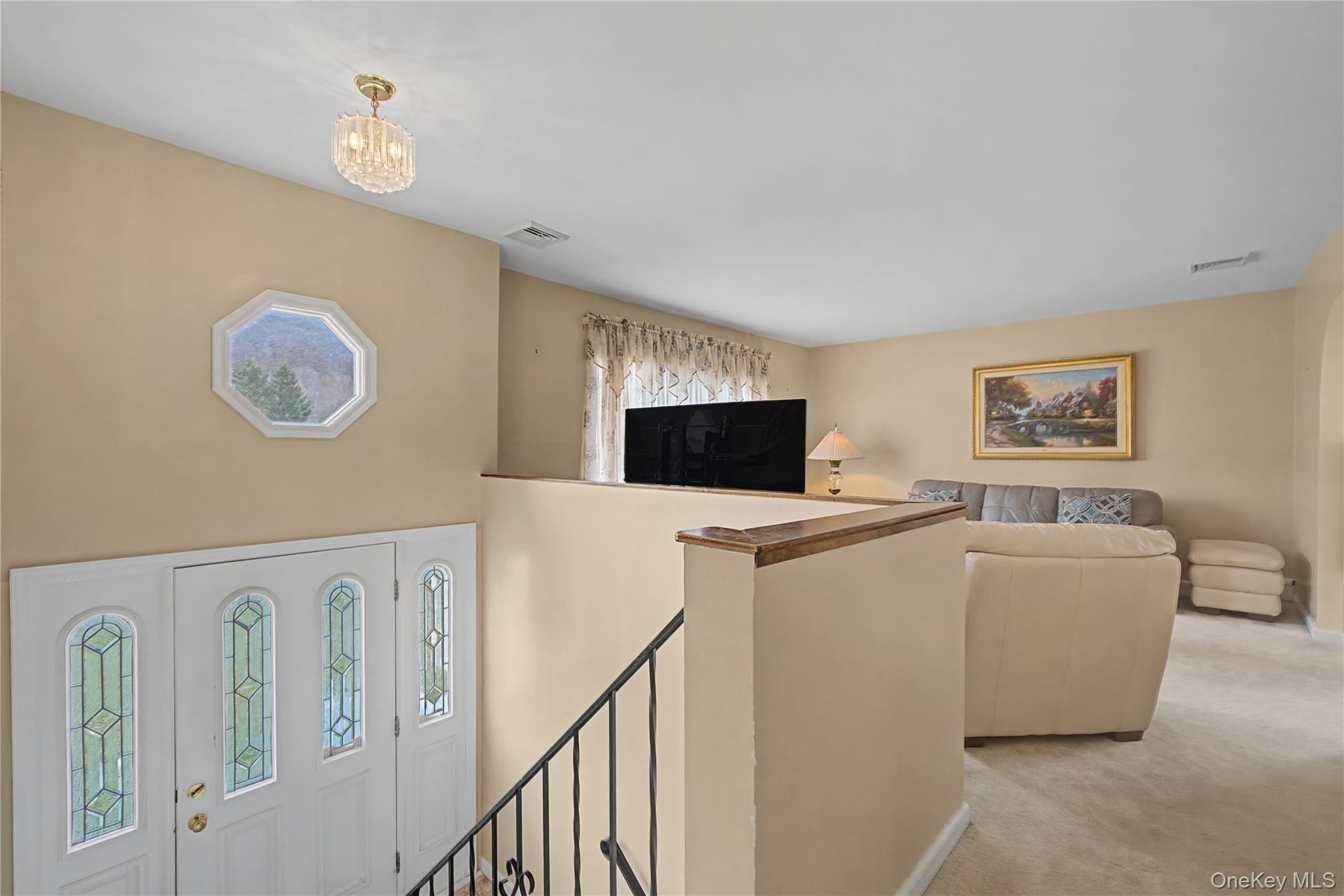 6 Adams Court Monroe, NY 10950 - Photo 5 of 44 a living room with furniture and a flat screen tv