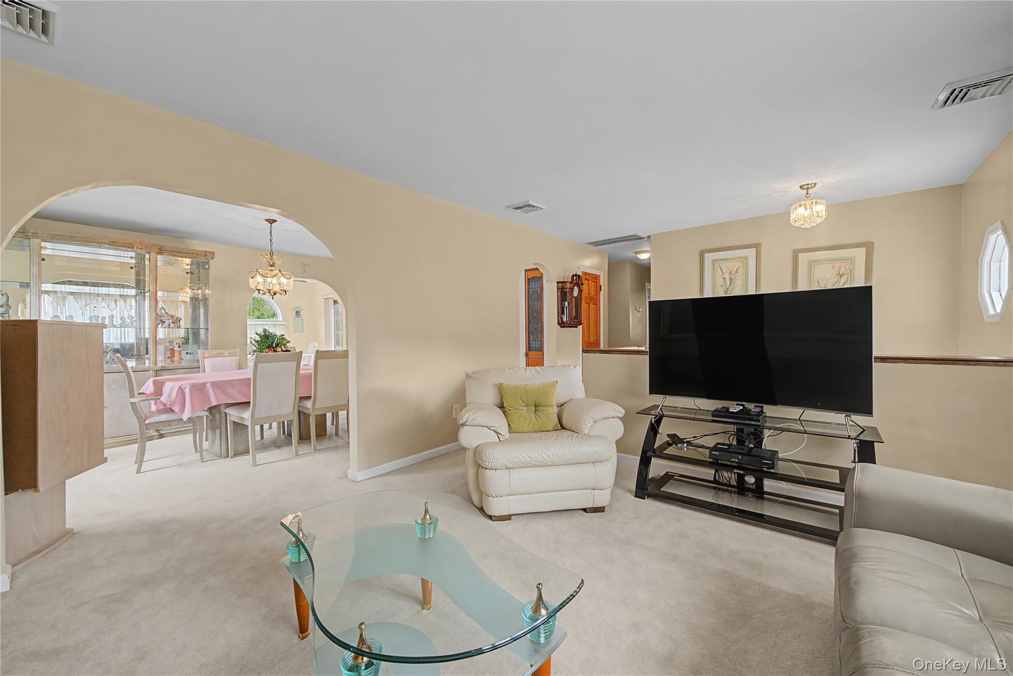 6 Adams Court Monroe, NY 10950 - Photo 8 of 44 a living room with furniture and a flat screen tv