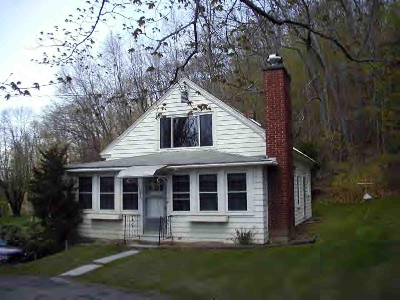 1105 Lenox Road Richmond, MA 01254 - Photo 1 of 1 a front view of a house with a yard