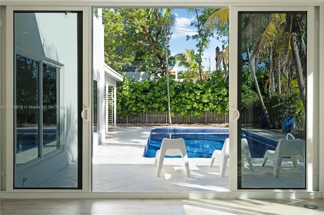 a view of patio with swimming pool and patio