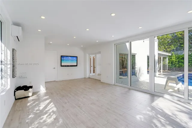a view of room with furniture and wooden floor