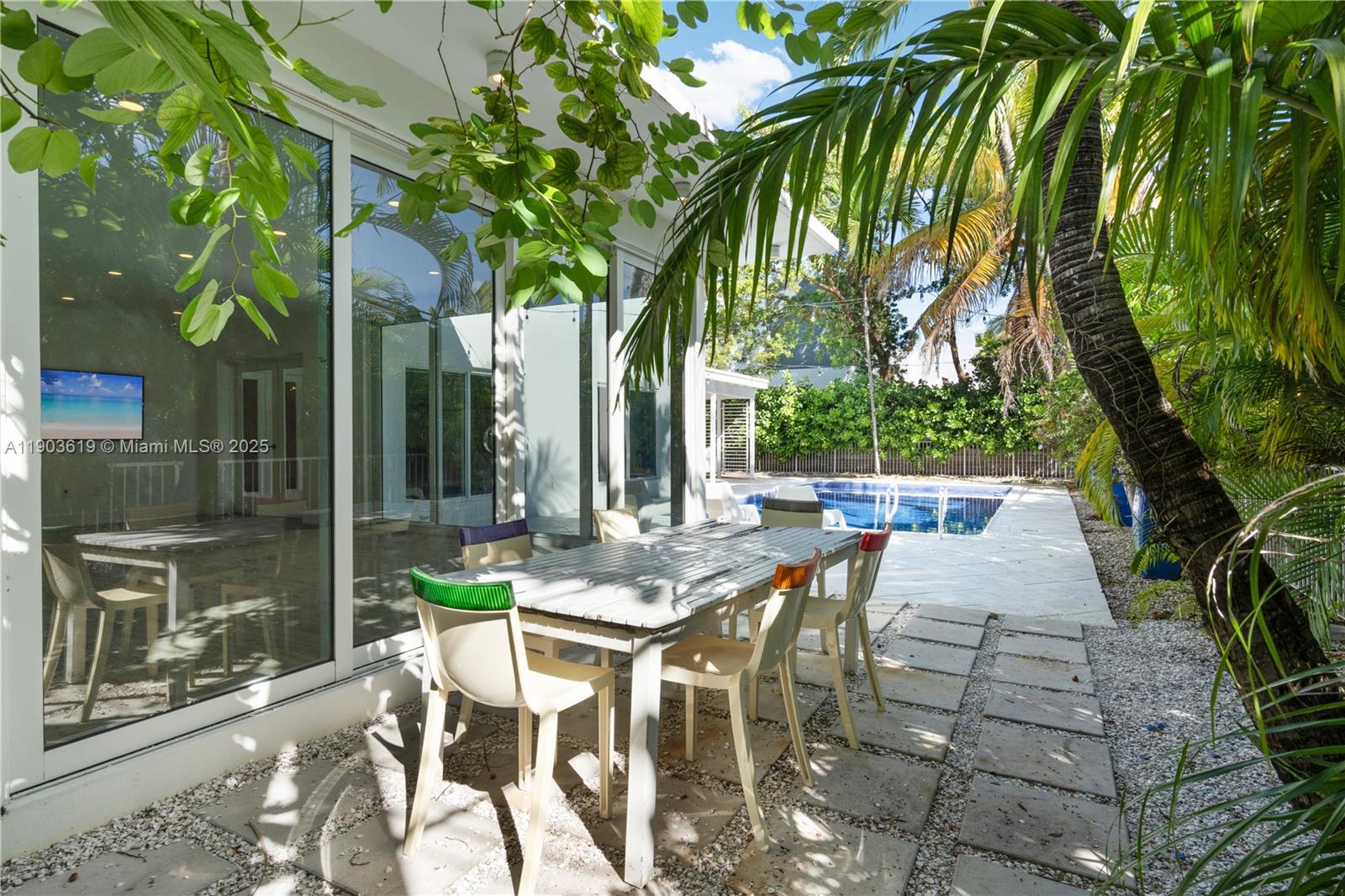 525 Ridgewood Road Key Biscayne, FL 33149 - Photo 14 of 58 a view of patio with swimming pool and patio