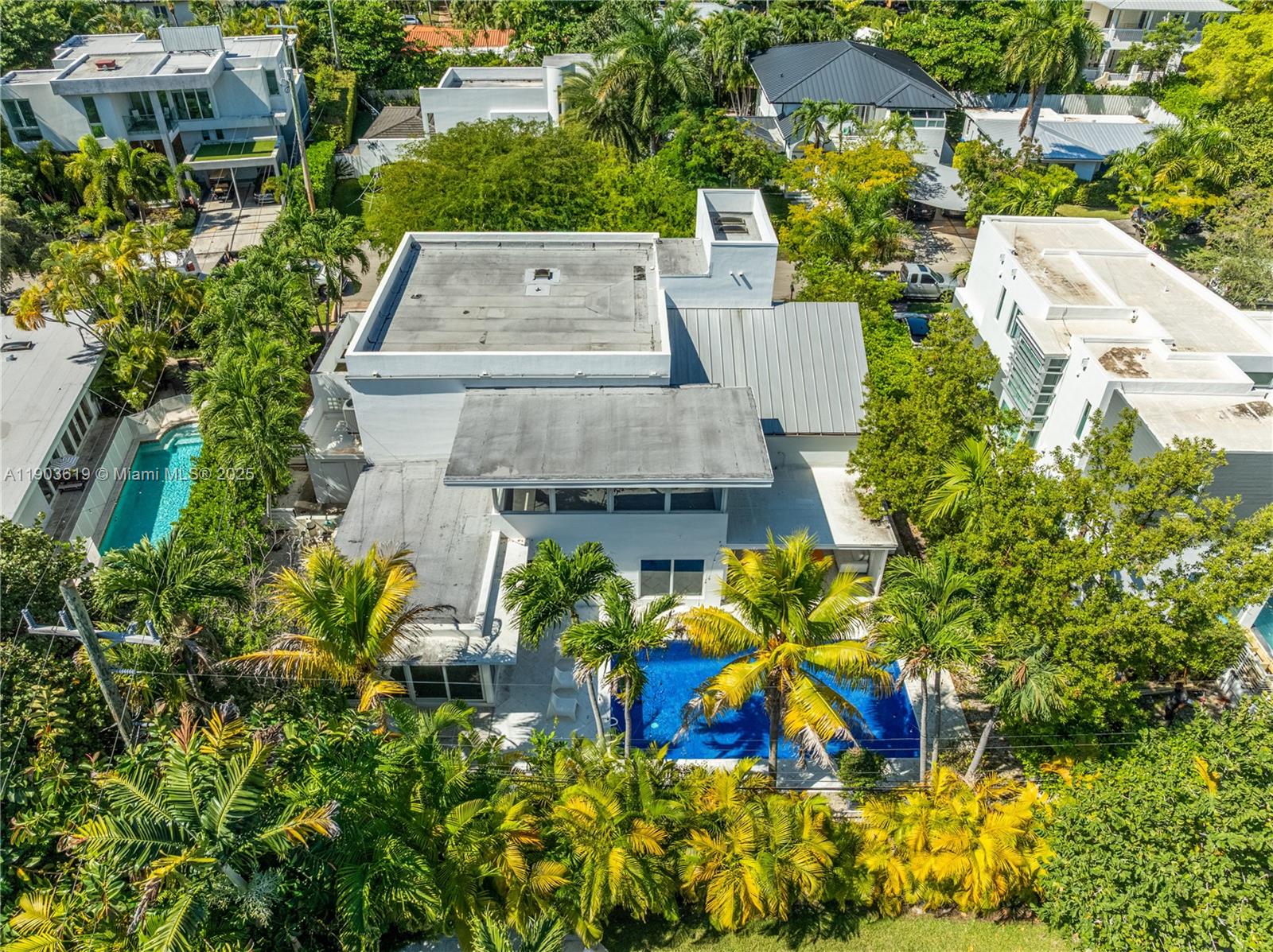 525 Ridgewood Road Key Biscayne, FL 33149 - Photo 16 of 58 an aerial view of a house with a yard and garden space