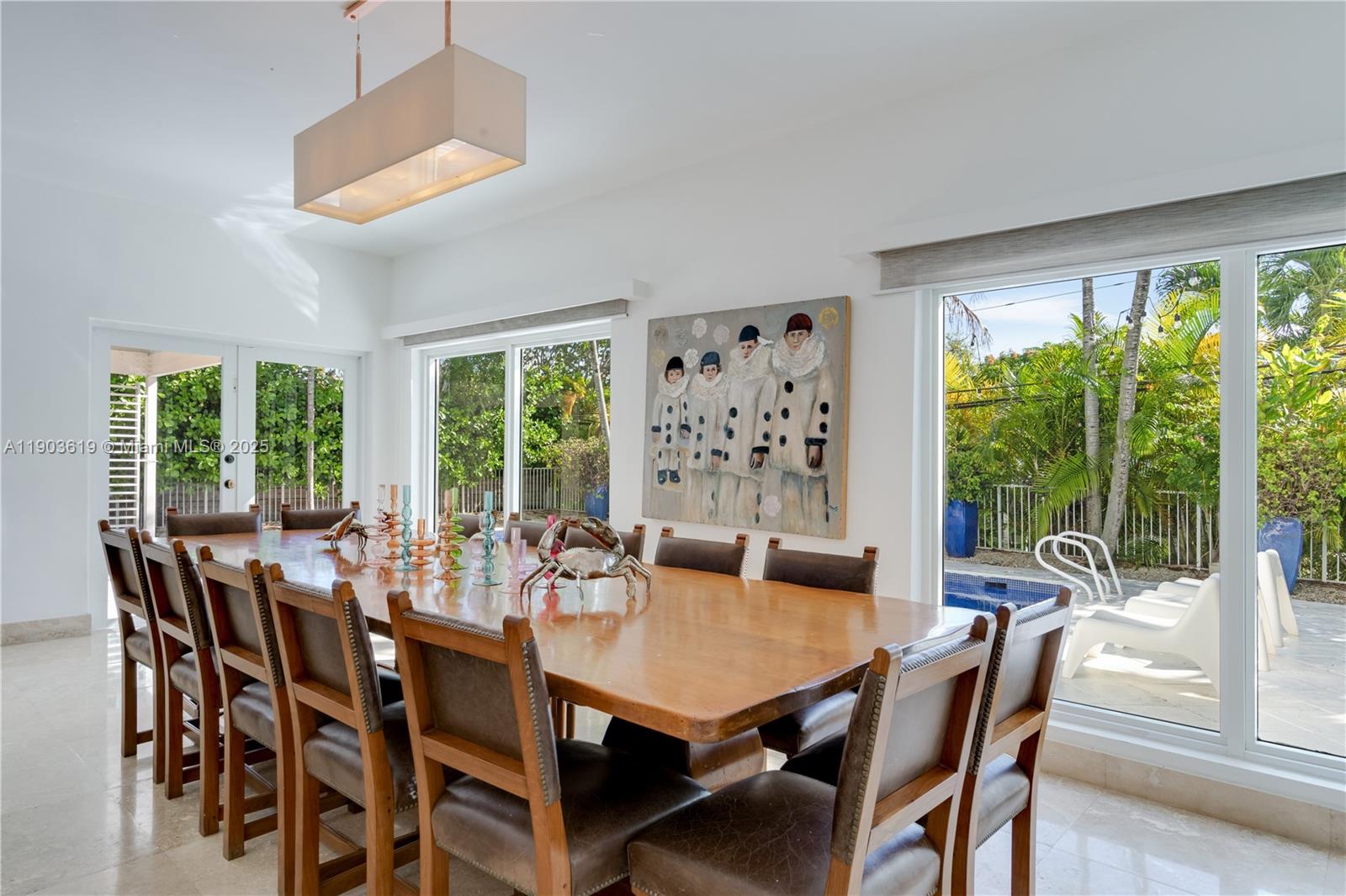 525 Ridgewood Road Key Biscayne, FL 33149 - Photo 23 of 58 a view of a dining room with furniture window and outside view
