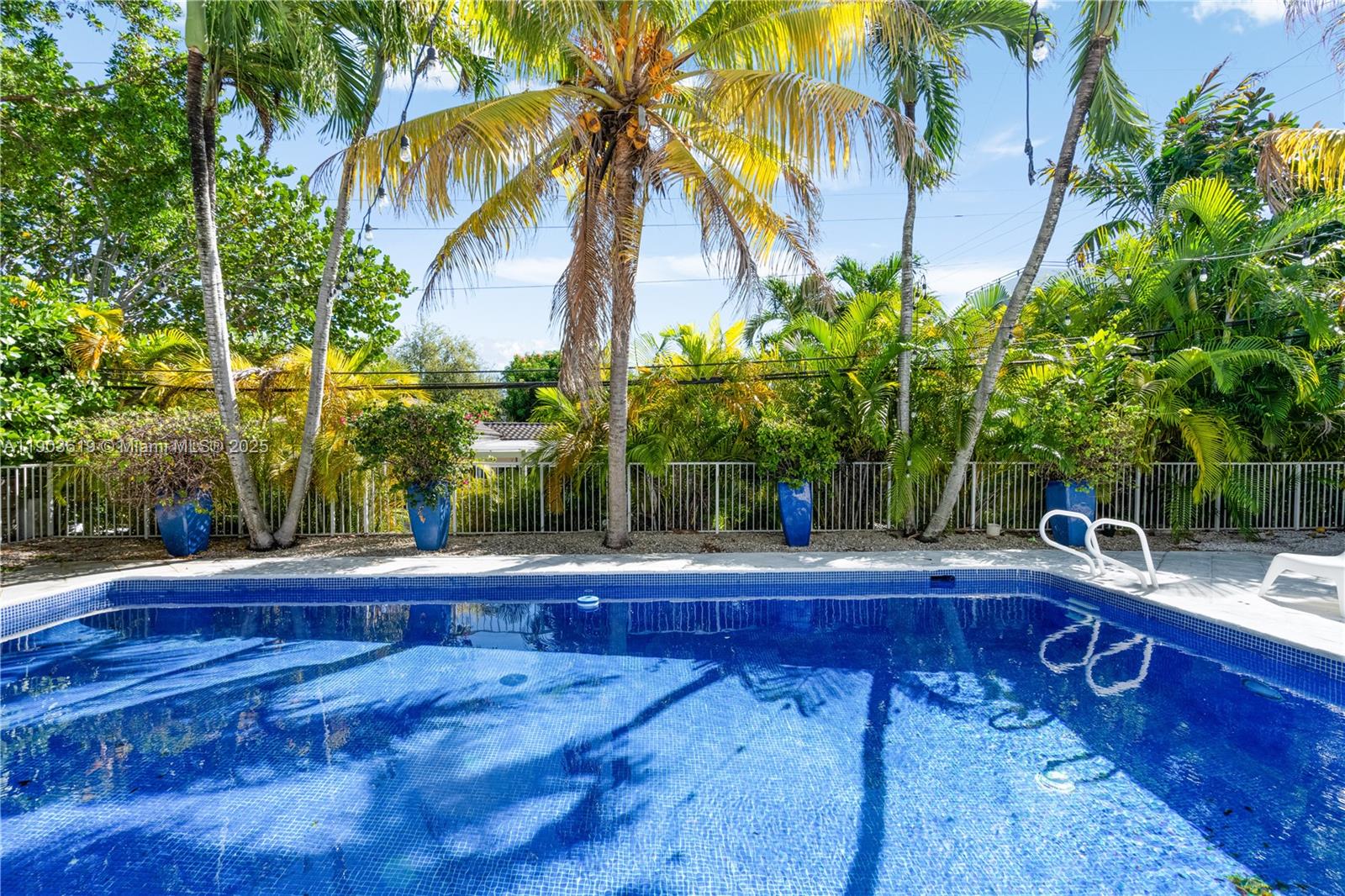 525 Ridgewood Road Key Biscayne, FL 33149 - Photo 31 of 58 a view of backyard with swimming pool and seating