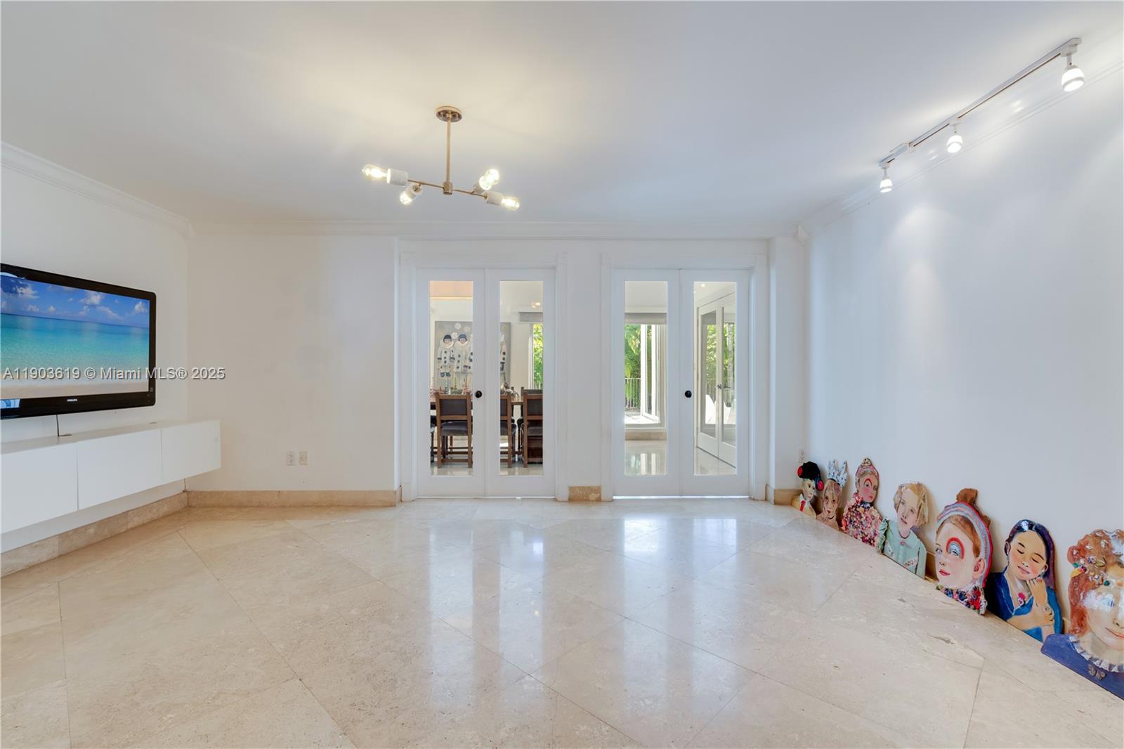 525 Ridgewood Road Key Biscayne, FL 33149 - Photo 32 of 58 an empty room with windows and ceiling fan