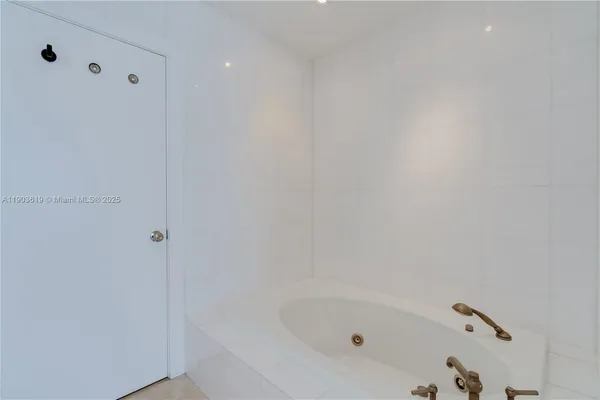 a en suite bathroom with a sink and mirror
