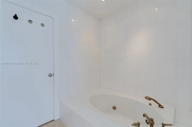 a en suite bathroom with a sink and mirror