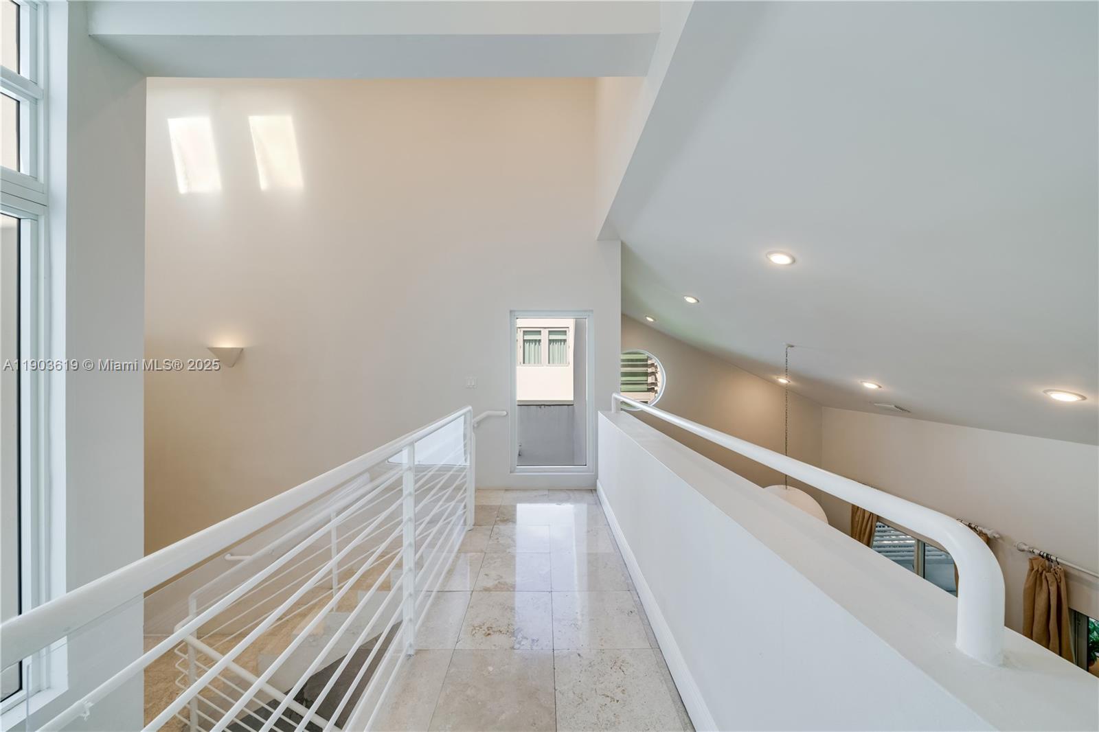 525 Ridgewood Road Key Biscayne, FL 33149 - Photo 57 of 58 a view of a hallway with stairs