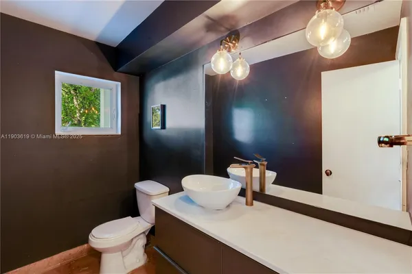 a view of a hallway with wooden shelves
