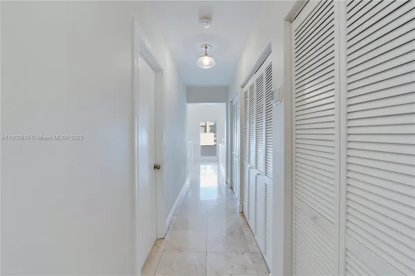 a kitchen with a sink cabinets and window
