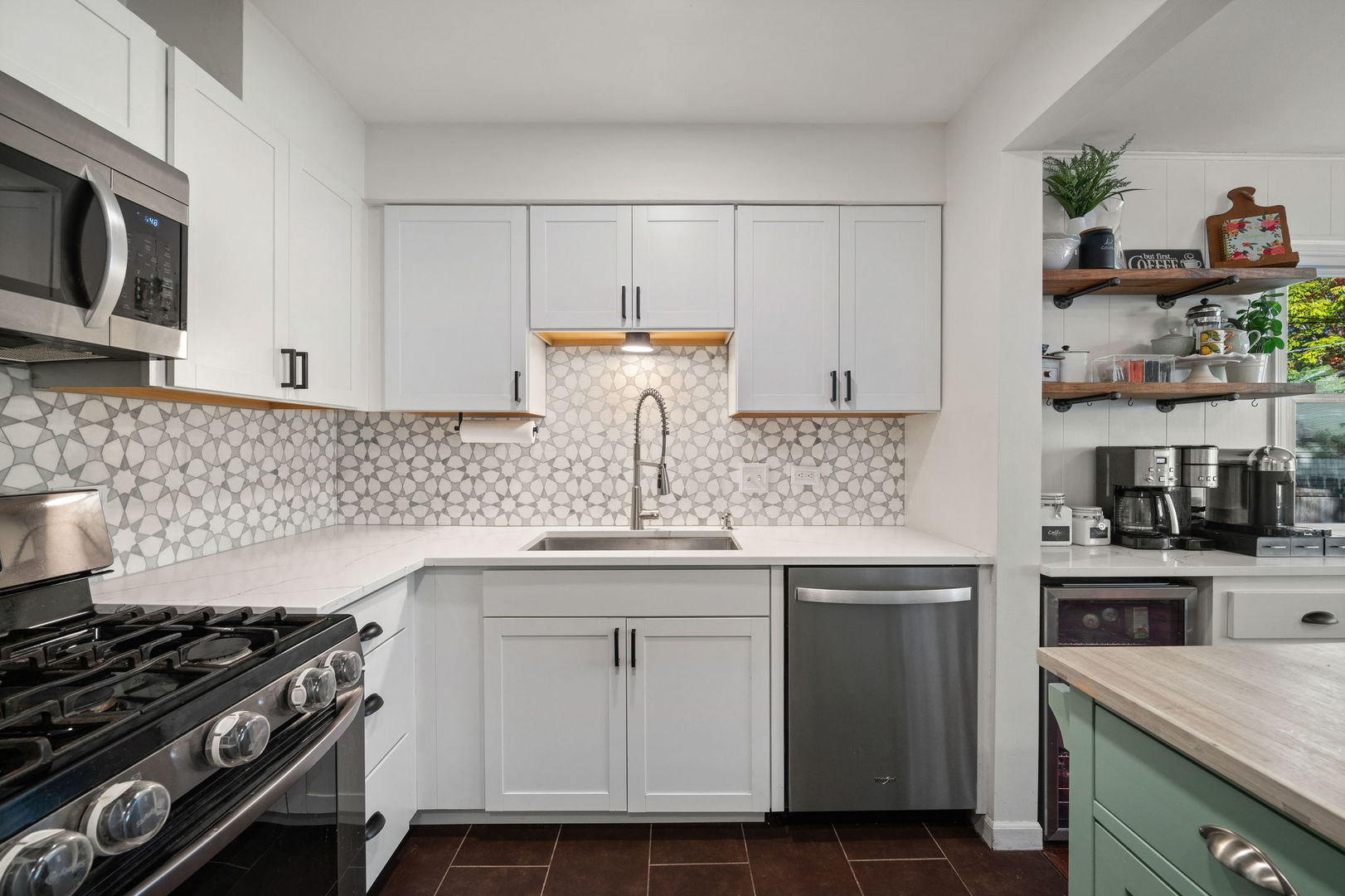 349 South Edgewood Avenue Lombard, IL 60148 - Photo 5 of 25 a kitchen with stainless steel appliances granite countertop a sink stove and cabinets