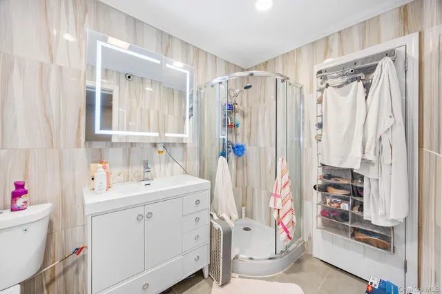 a view of a patio with a table and chairs and potted plants