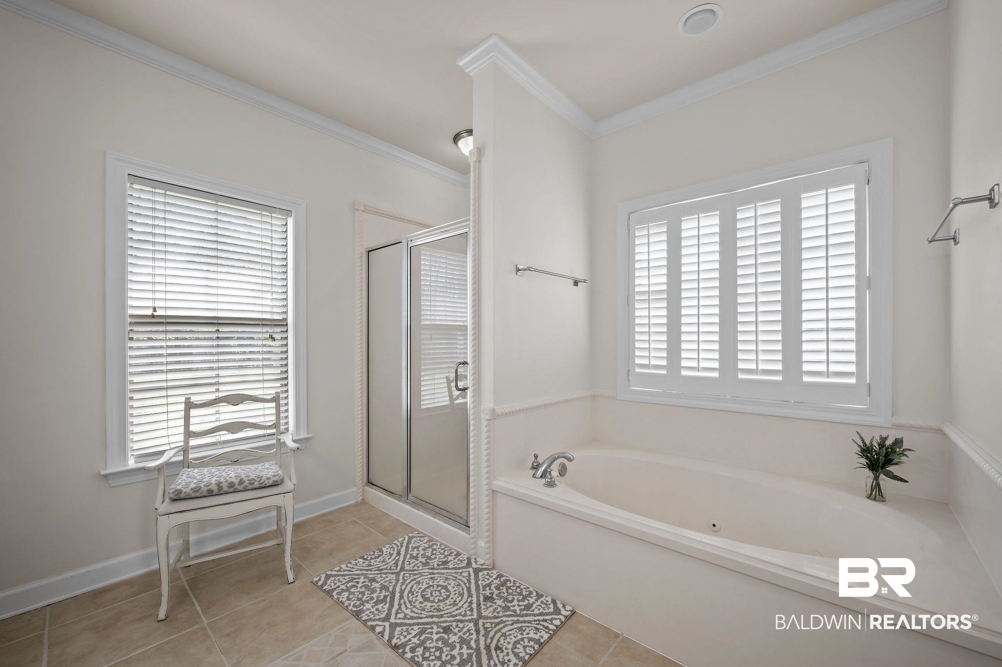 9837 Harmony Ridge Drive Semmes, AL 36575 - Photo 22 of 29 Full bathroom featuring a stall shower, crown molding, tile patterned flooring, and a bath