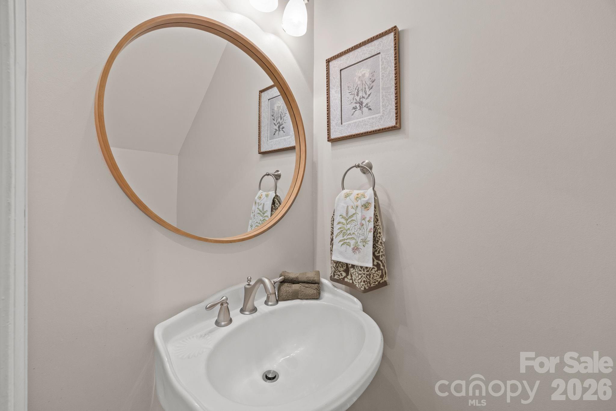 5243 Mintridge Road Mint Hill, NC 28227 - Photo 18 of 43 a bathroom with a sink and a mirror