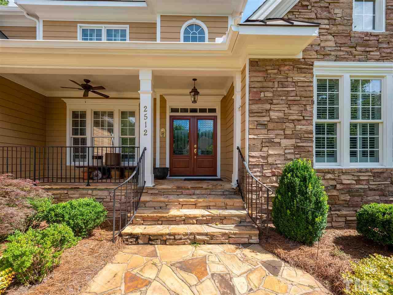 2512 Brook Crossing Circle Raleigh, NC 27606 - Photo 2 of 28 a front view of a house with a garden