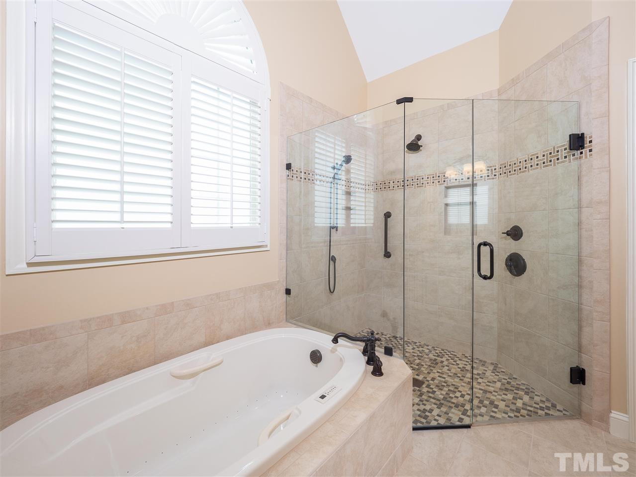 2512 Brook Crossing Circle Raleigh, NC 27606 - Photo 13 of 28 a bathroom with a bathtub and shower