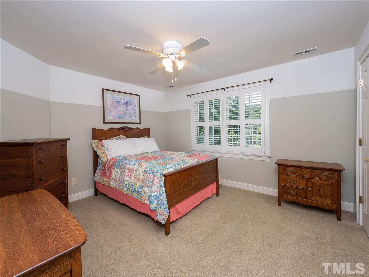 2512 Brook Crossing Circle Raleigh, NC 27606 - Photo 15 of 28 a bedroom with a bed and a window