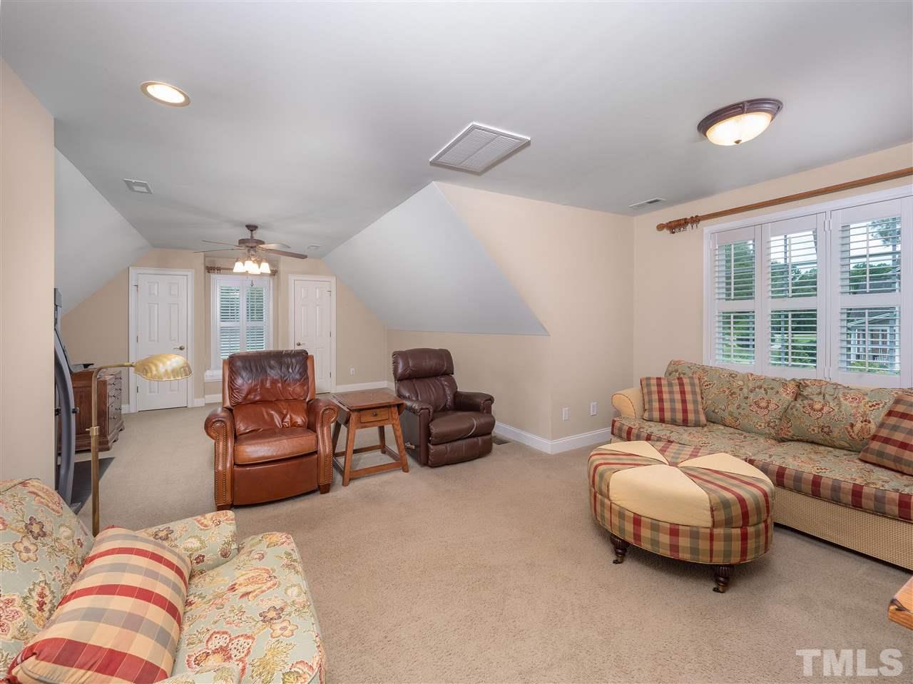 2512 Brook Crossing Circle Raleigh, NC 27606 - Photo 20 of 28 a living room with furniture and a large window