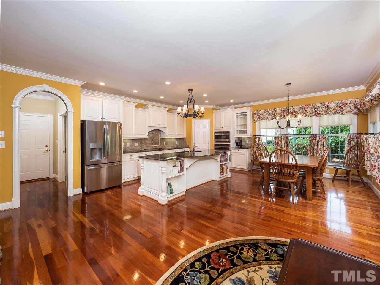 2512 Brook Crossing Circle Raleigh, NC 27606 - Photo 3 of 28 a living room with lots of furniture and kitchen view
