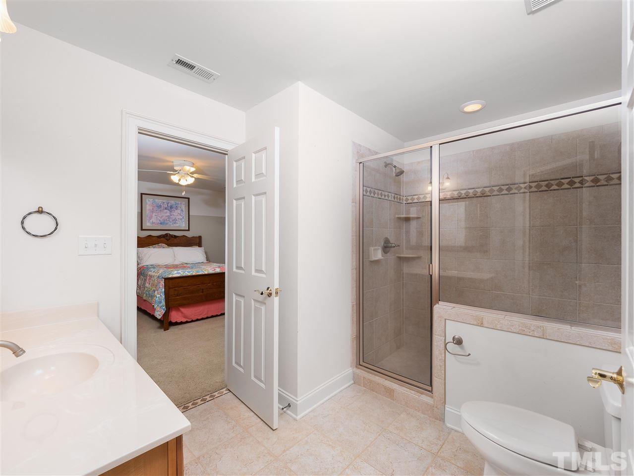 2512 Brook Crossing Circle Raleigh, NC 27606 - Photo 21 of 28 a bathroom with a sink a toilet and shower
