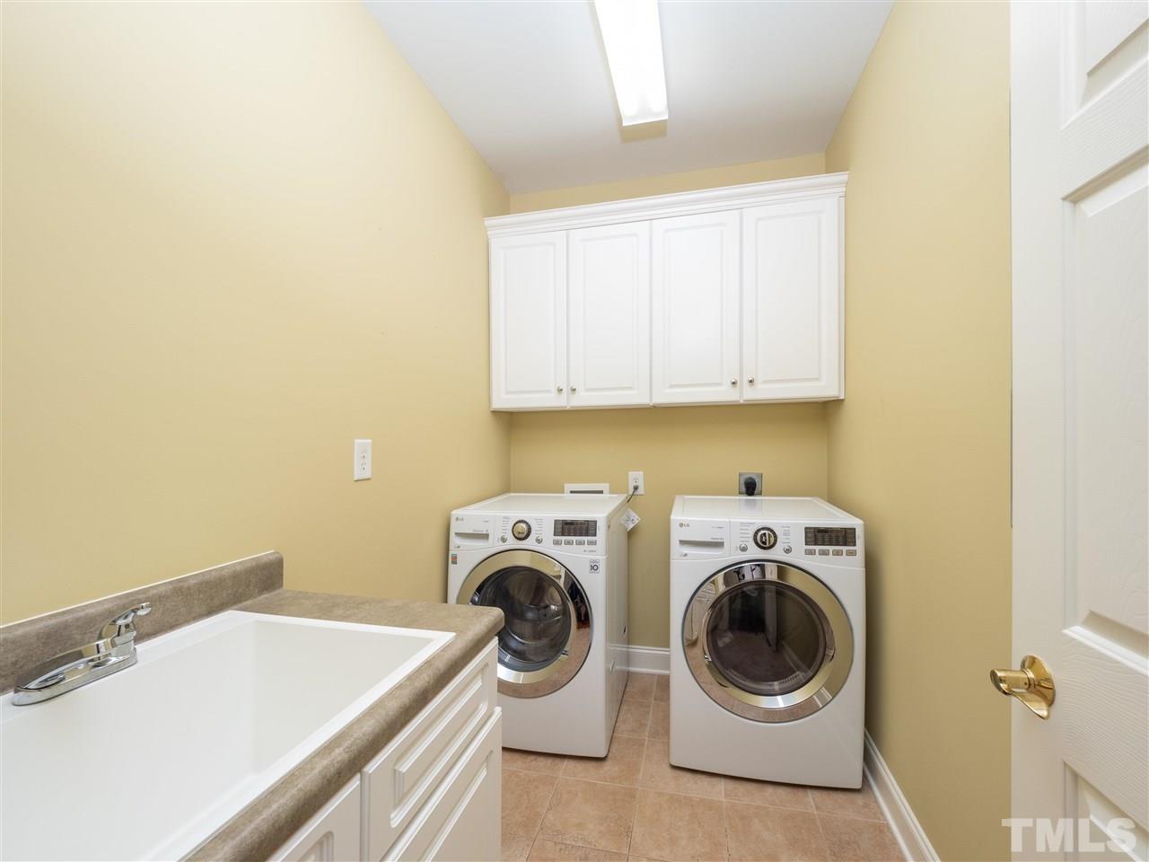 2512 Brook Crossing Circle Raleigh, NC 27606 - Photo 22 of 28 a utility room with dryer and washer