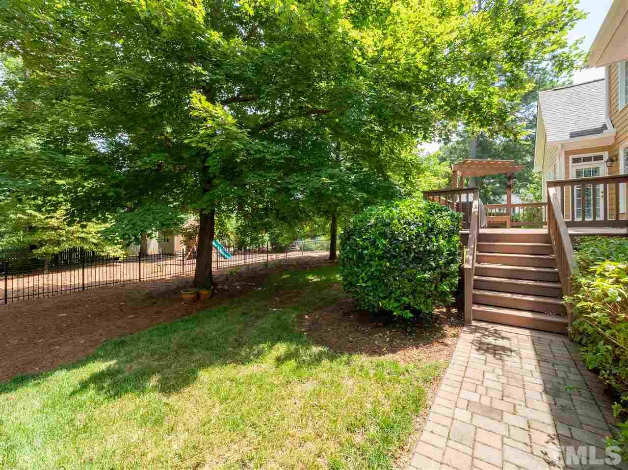 2512 Brook Crossing Circle Raleigh, NC 27606 - Photo 24 of 28 a view of a yard with plants and trees