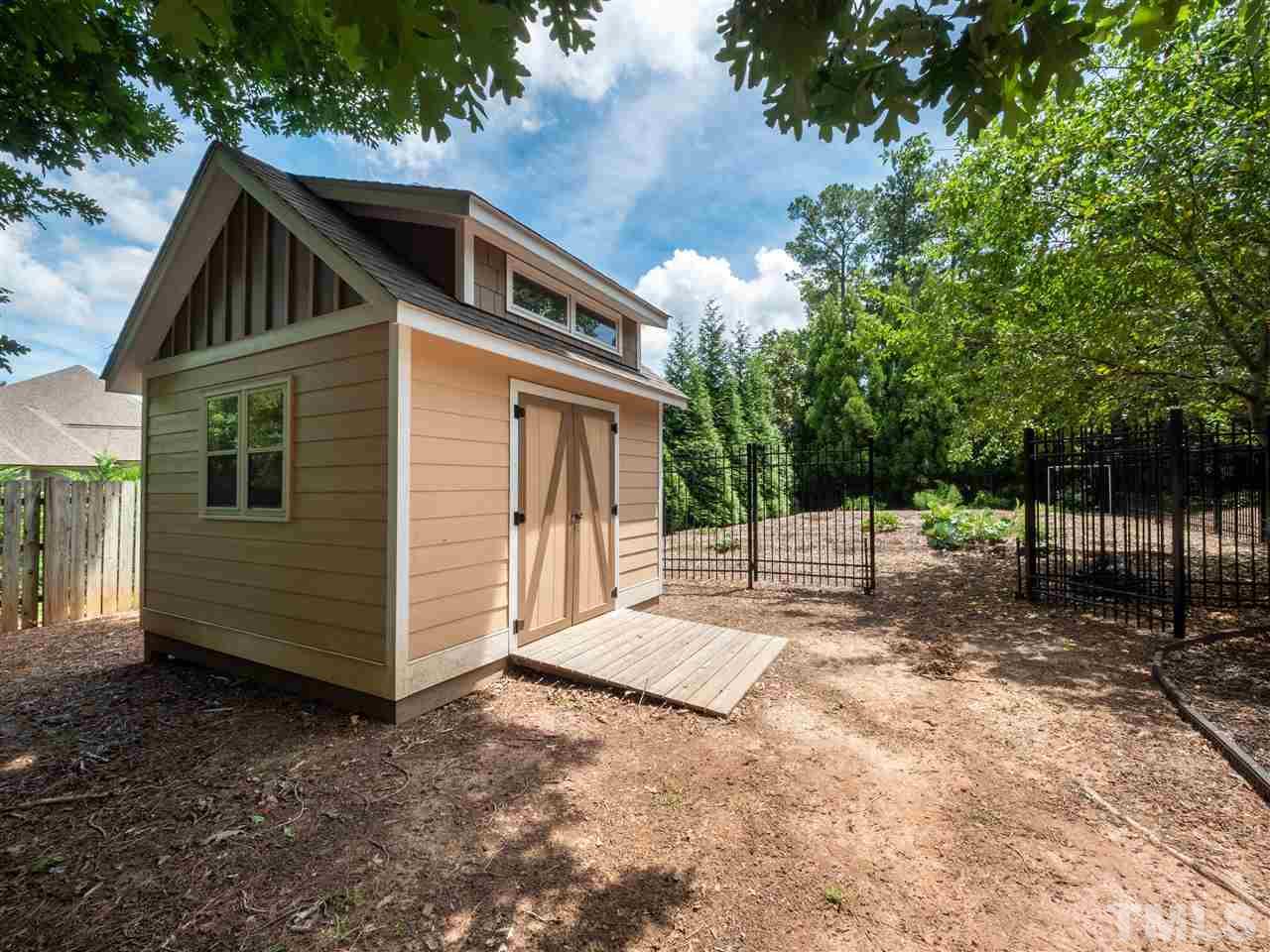 2512 Brook Crossing Circle Raleigh, NC 27606 - Photo 26 of 28 a front view of a house with a yard