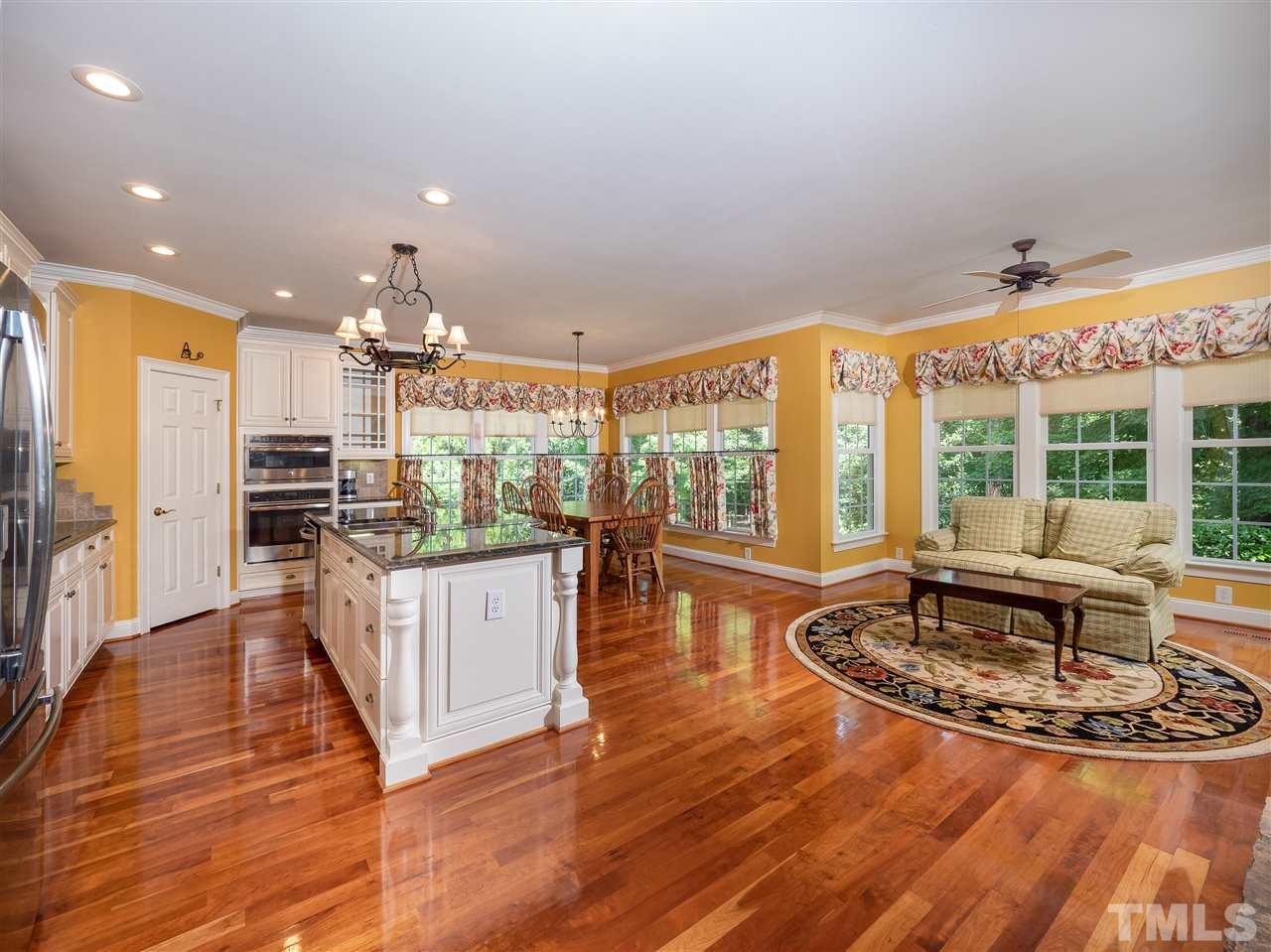 2512 Brook Crossing Circle Raleigh, NC 27606 - Photo 4 of 28 a kitchen with stainless steel appliances granite countertop a stove and refrigerator
