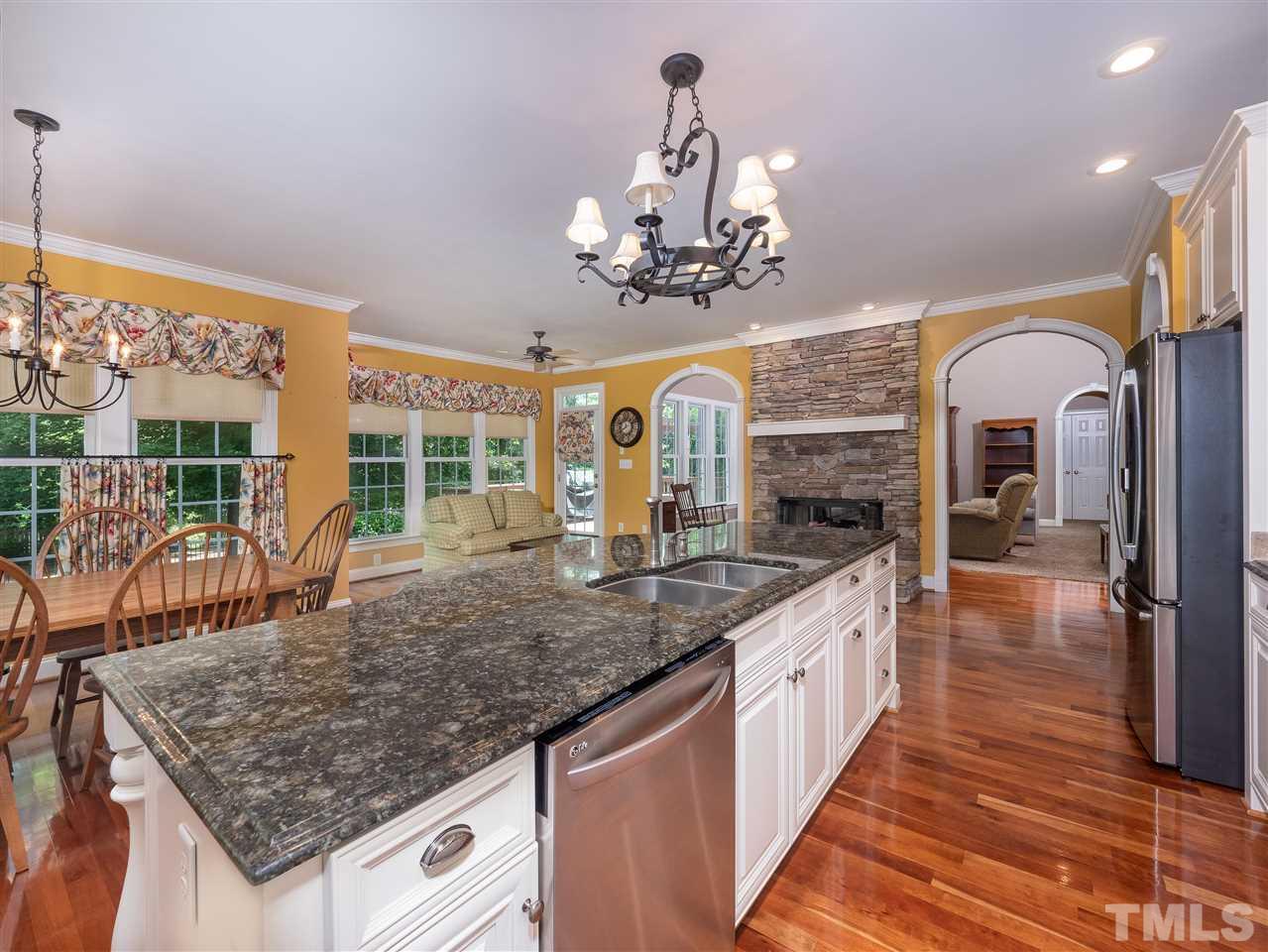 2512 Brook Crossing Circle Raleigh, NC 27606 - Photo 5 of 28 a kitchen with stainless steel appliances granite countertop a sink and a counter space