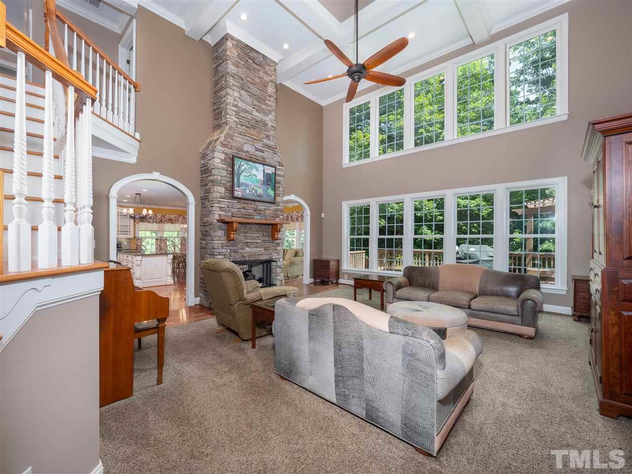 2512 Brook Crossing Circle Raleigh, NC 27606 - Photo 6 of 28 a living room with fireplace furniture and a large window
