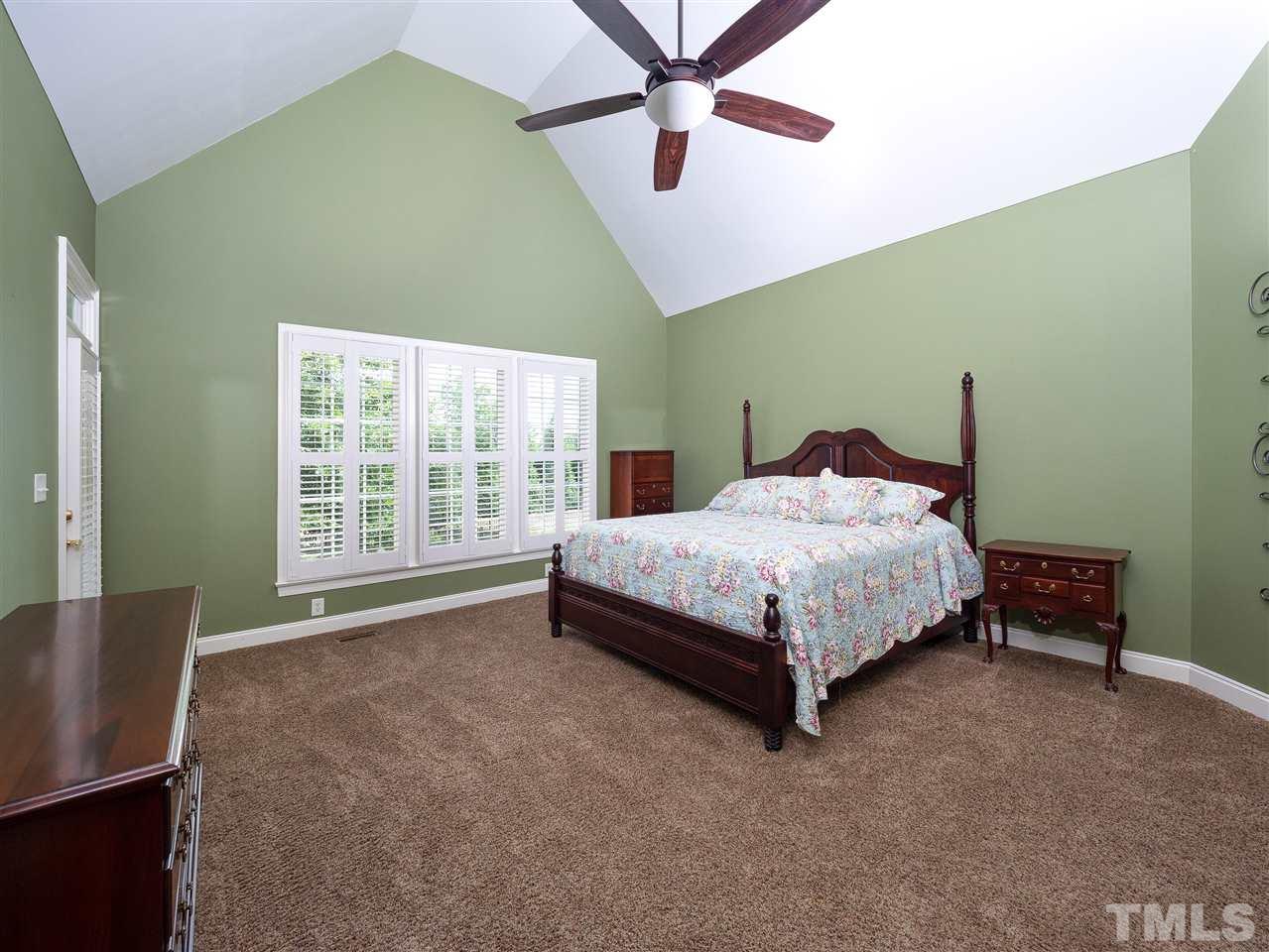 2512 Brook Crossing Circle Raleigh, NC 27606 - Photo 10 of 28 a bed sitting in a spacious bedroom next to a window