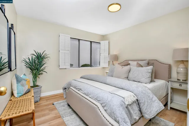 a bedroom with a bed and window