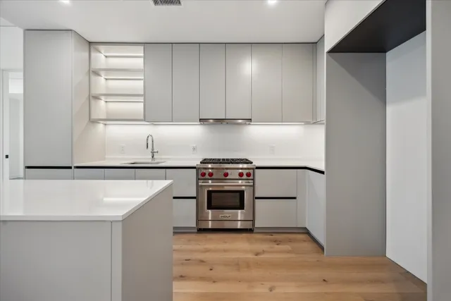 a kitchen with a stove and a microwave