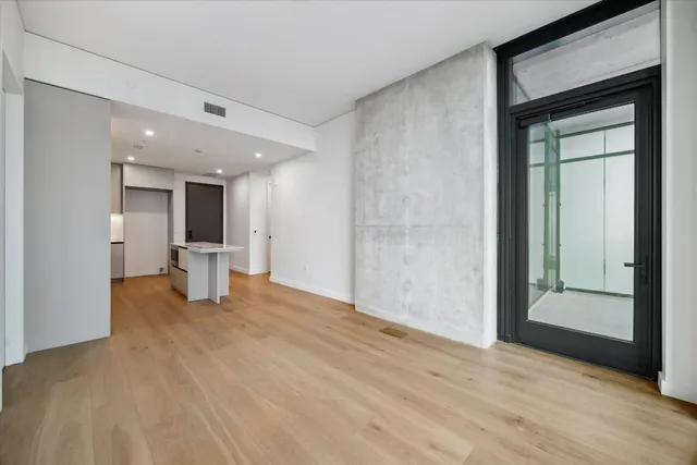 a view of a living room with a large window