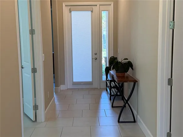 a room that has a bed and a mirror in it