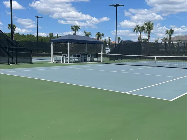 a view of a street with a building in the background